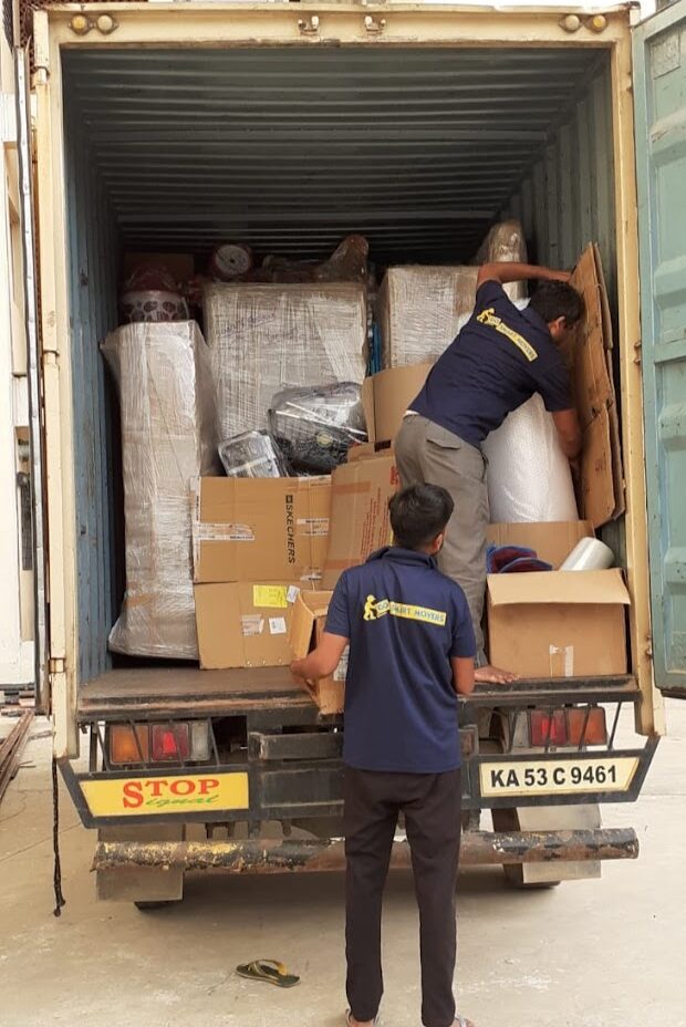 GoSmart Movers and packers team loading household goods into a truck in KR puram