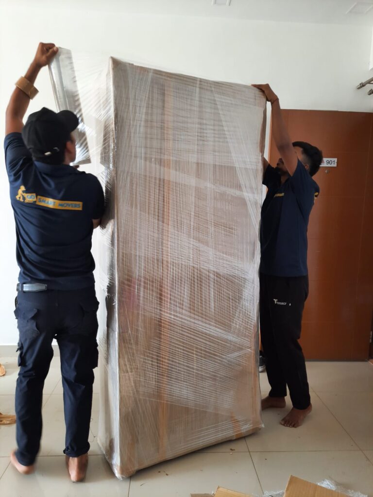 GoSmart Movers team packing a cupboard